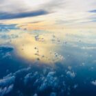 A view from a plane of clouds in the sky