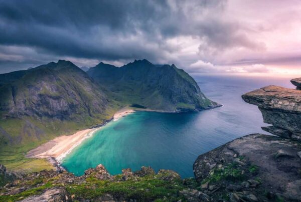 A beach and bay around a mountainous coastline