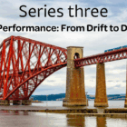 Big red iron bridge across a river for the portfolio performance article